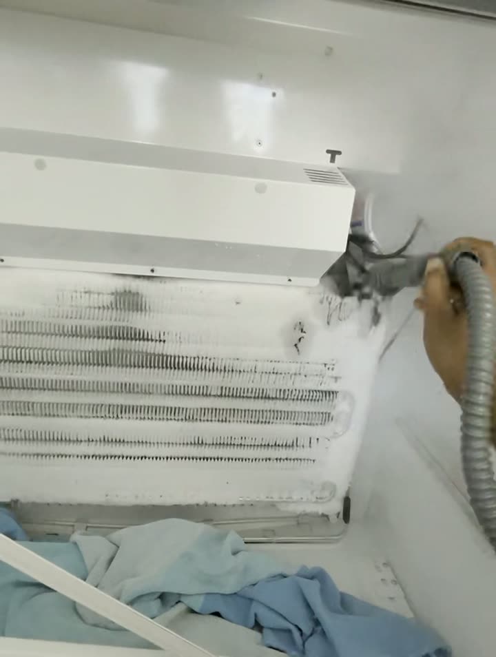 Clearing frost and buildup from a freezer evaporator coil